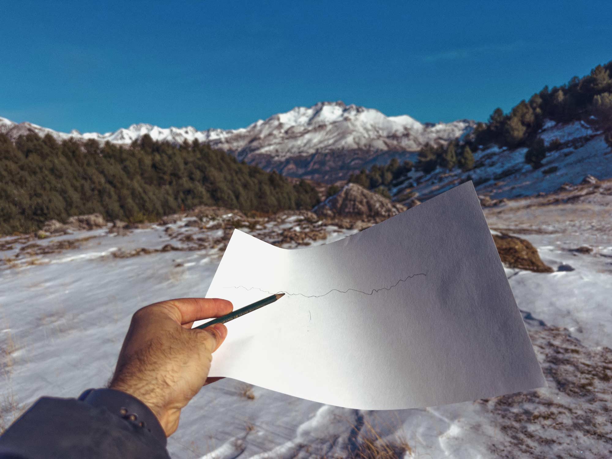 Snow and a rock in the middle